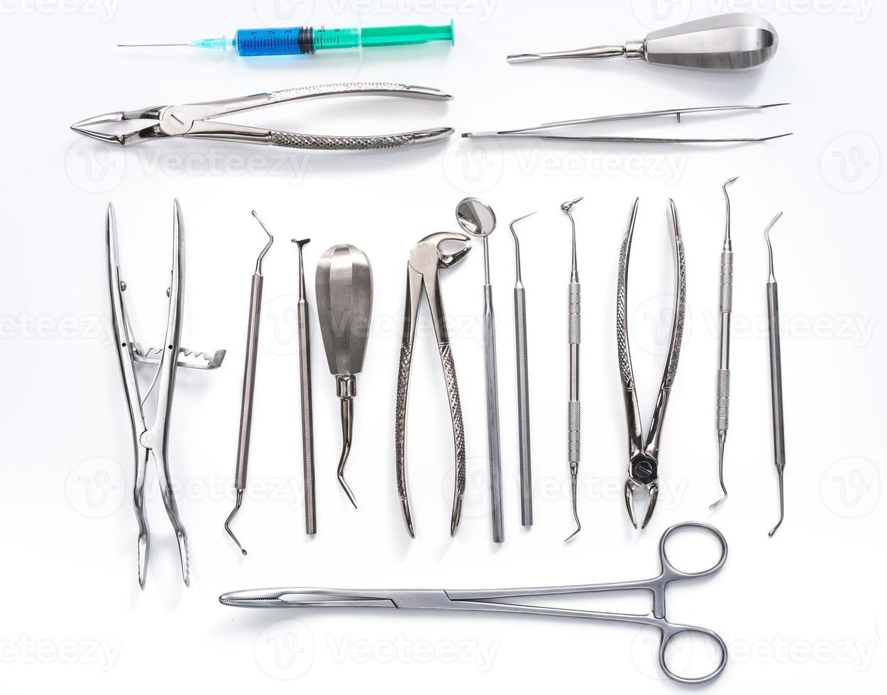 Dental tools on white background photo