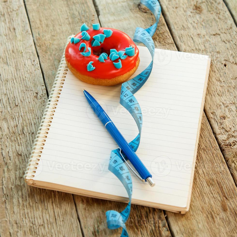 Colorful donuts and notepad photo