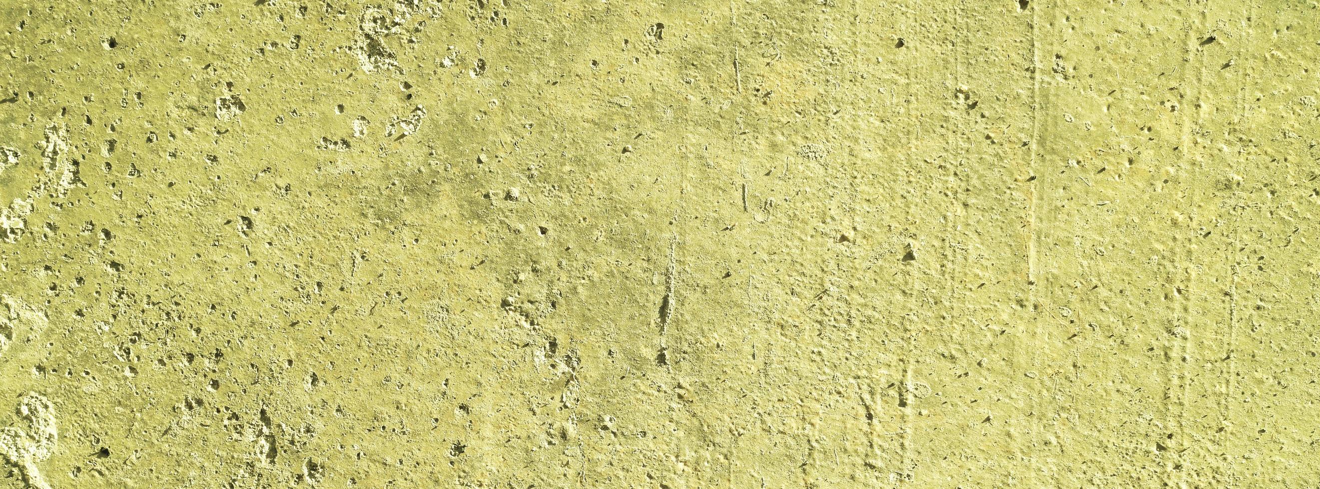 Yellow wall background.concrete wall plastered yellow scratch background.grunge texture. photo