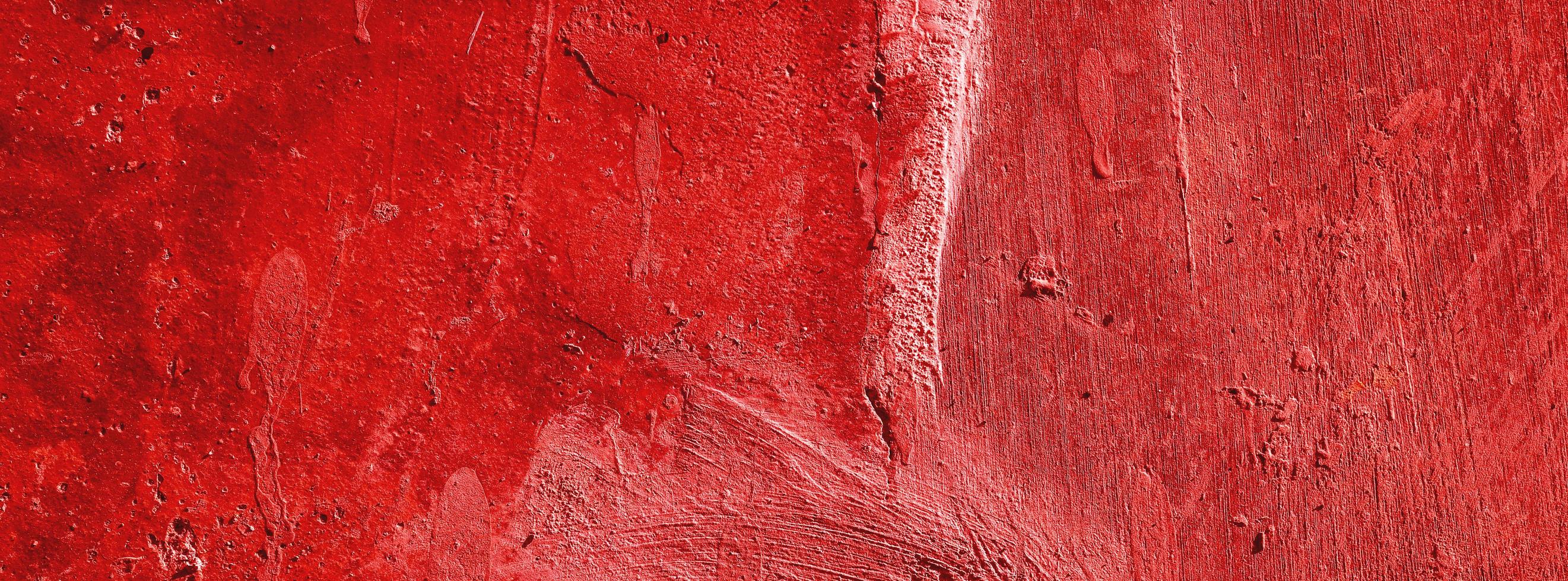 Red wall.scary background.concrete wall plastered red scratch background.grunge texture. photo