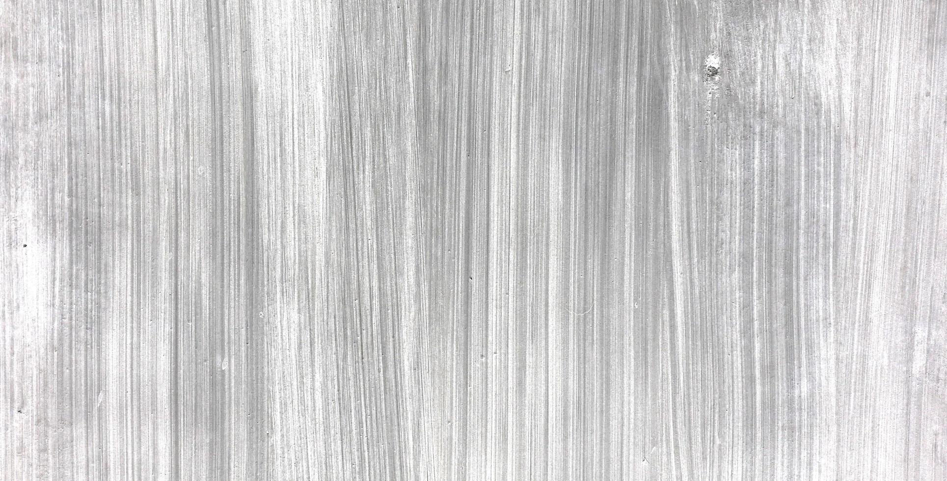 Old dirty concrete wall as a background. Gray cement plaster. Wall texture for background. Brush scratches on the wall photo