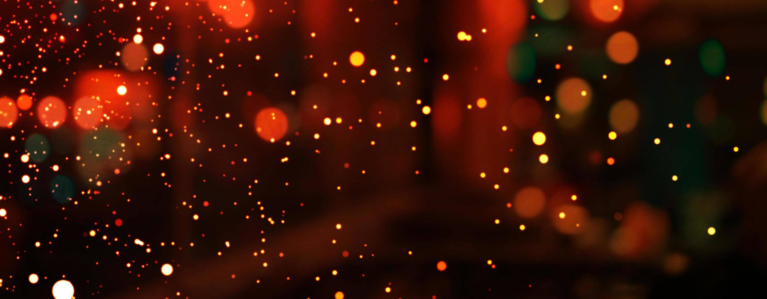 Abstract Christmas glitter lights background. Blured Christmas and New Year light. photo