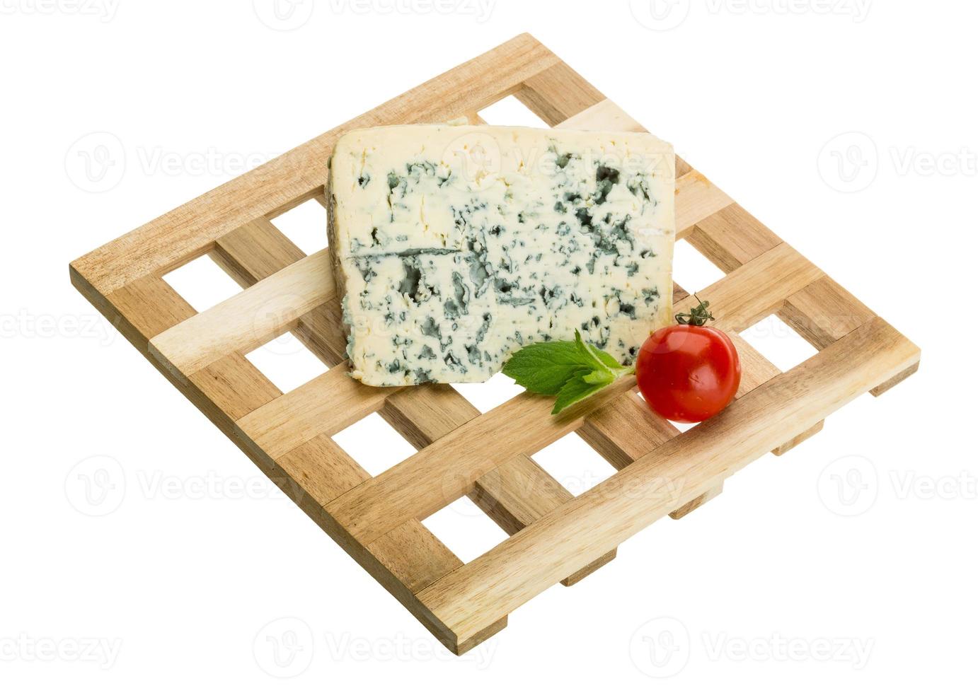 Blue cheese on board  isolated on white background photo
