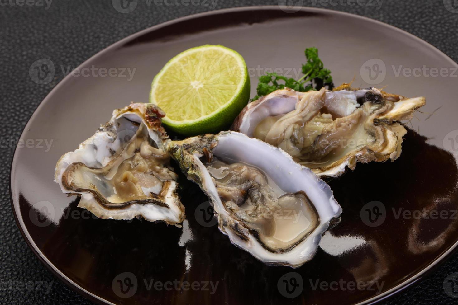 Oysters with lime and parsley photo