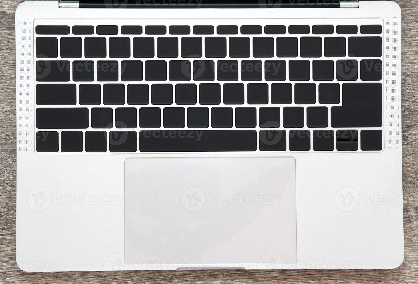 empty keyboard on table background photo