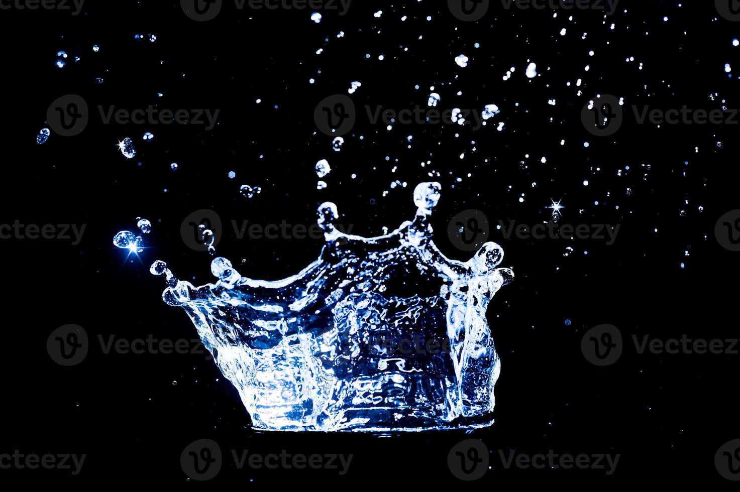 Scattered water splashes on a black background. water splash isolated on the black background photo