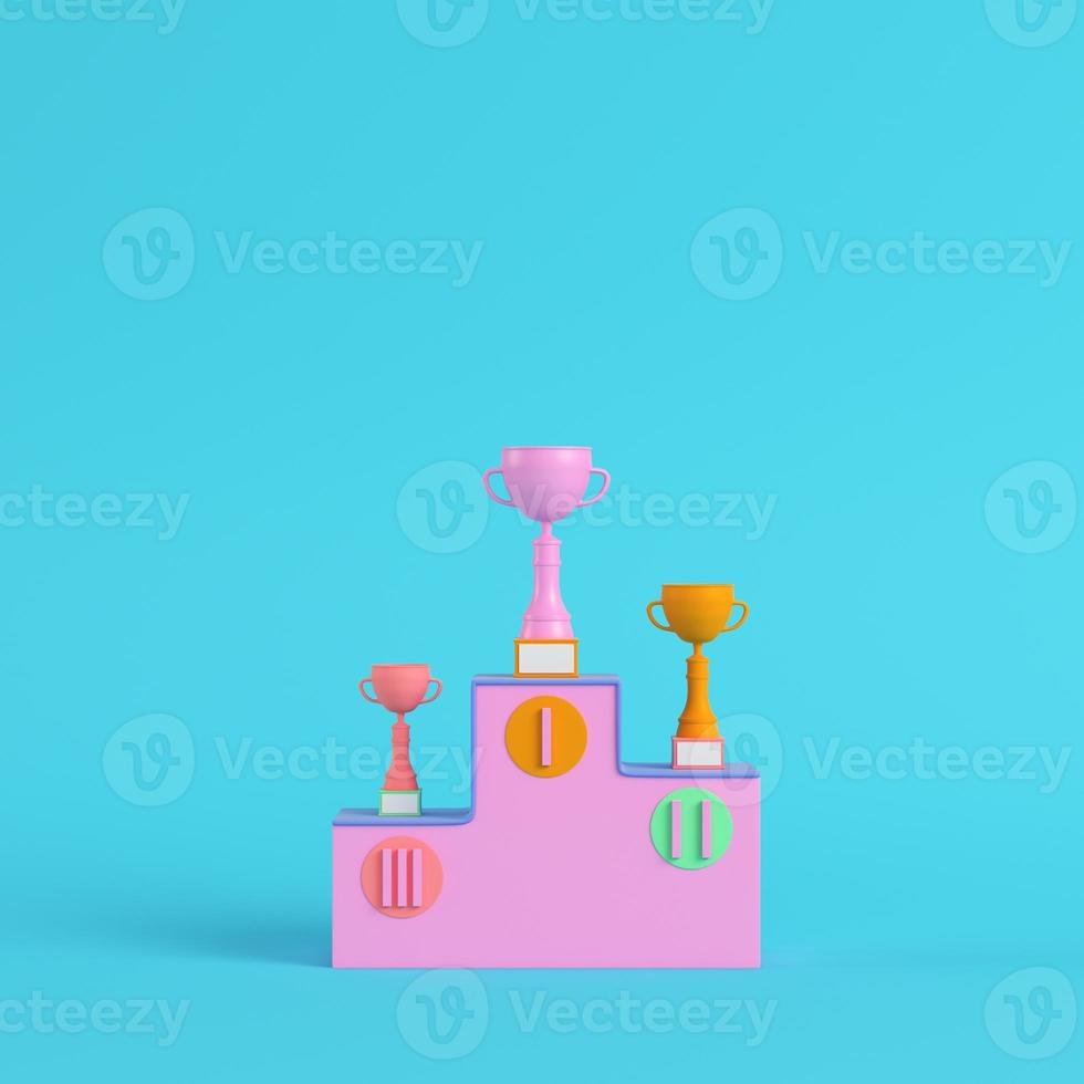 Pedestal with trophy cups on bright blue background in pastel colors. Minimalism concept photo