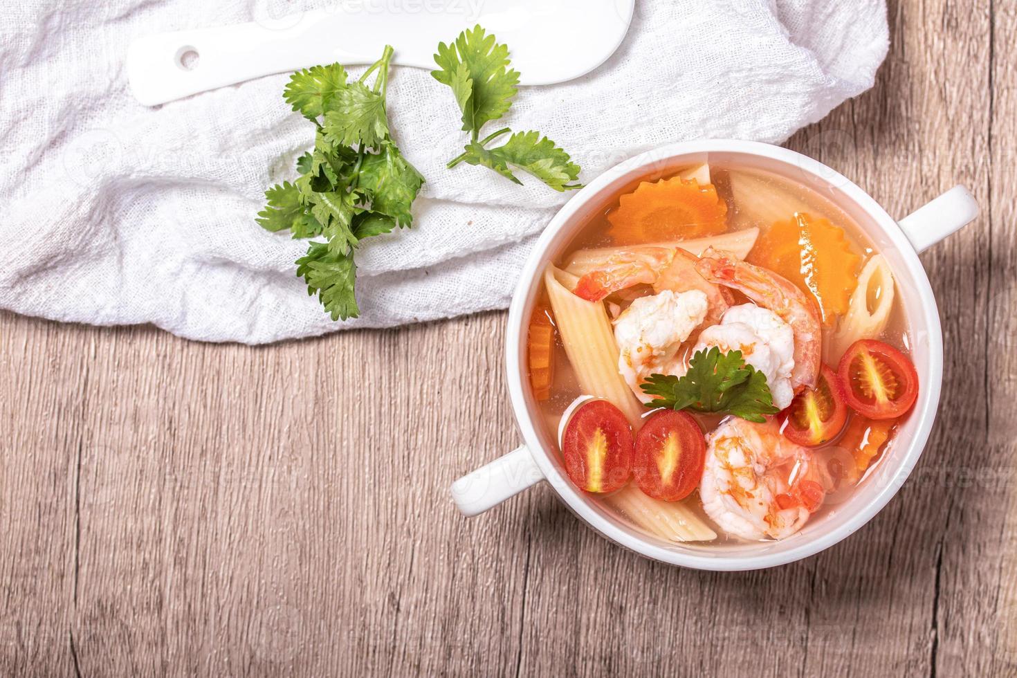 Shrimp and Vegetable Macaroni Soup in White Bowl photo