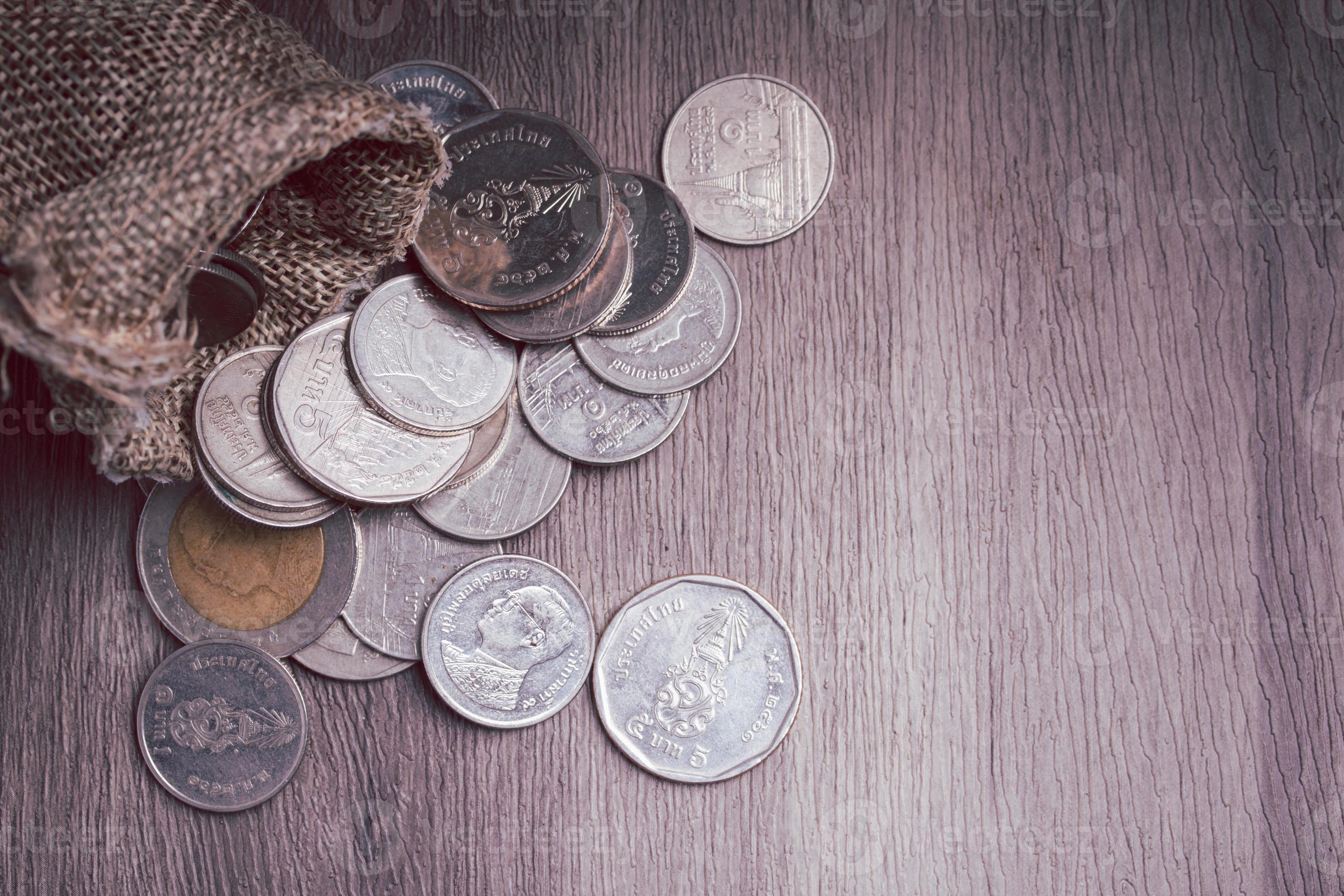 Coins in bags piled on the floor. Money saving concept. 8887096 Stock
