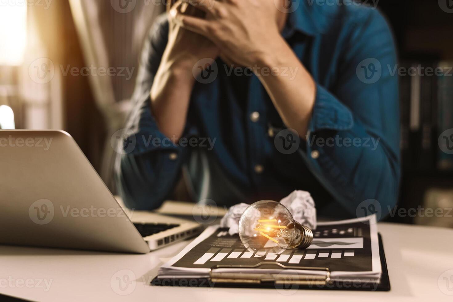 portrait of  light bulb,stressed business man with social network diagram photo