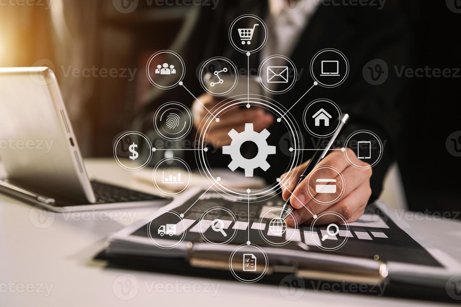 business documents on office table with smart phone and digital tablet and graph financial and man working photo