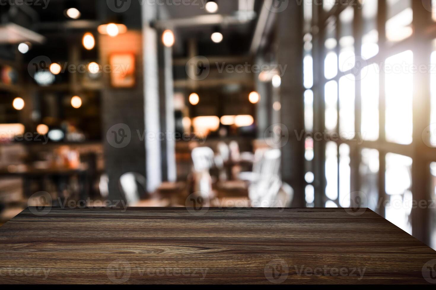 Empty top of wooden shelves on coffee shop ,tree front view background. For product display blur background photo