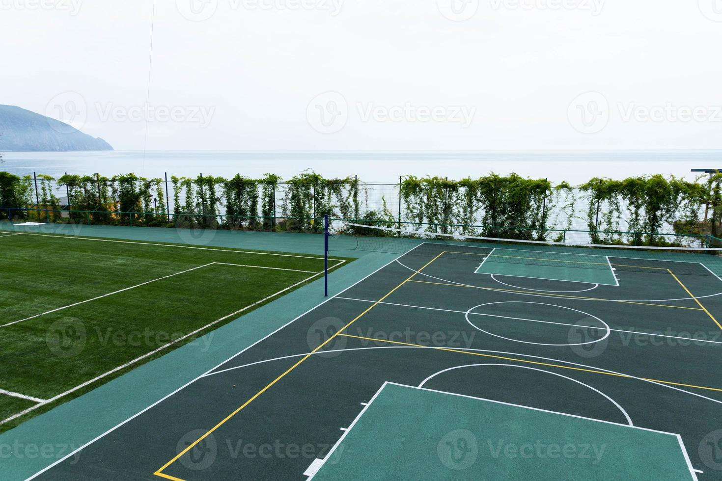 Outdoor Volleyball court with a net in the morning next to the sea. photo