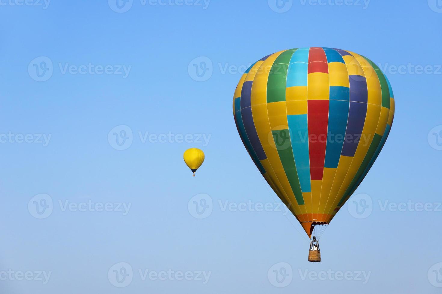 Colorful hot air balloon flying on sky. photo