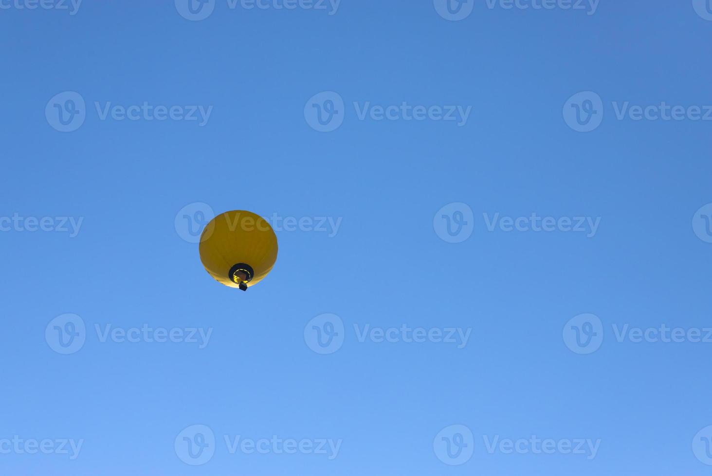 Colorful hot air balloon flying on sky. photo