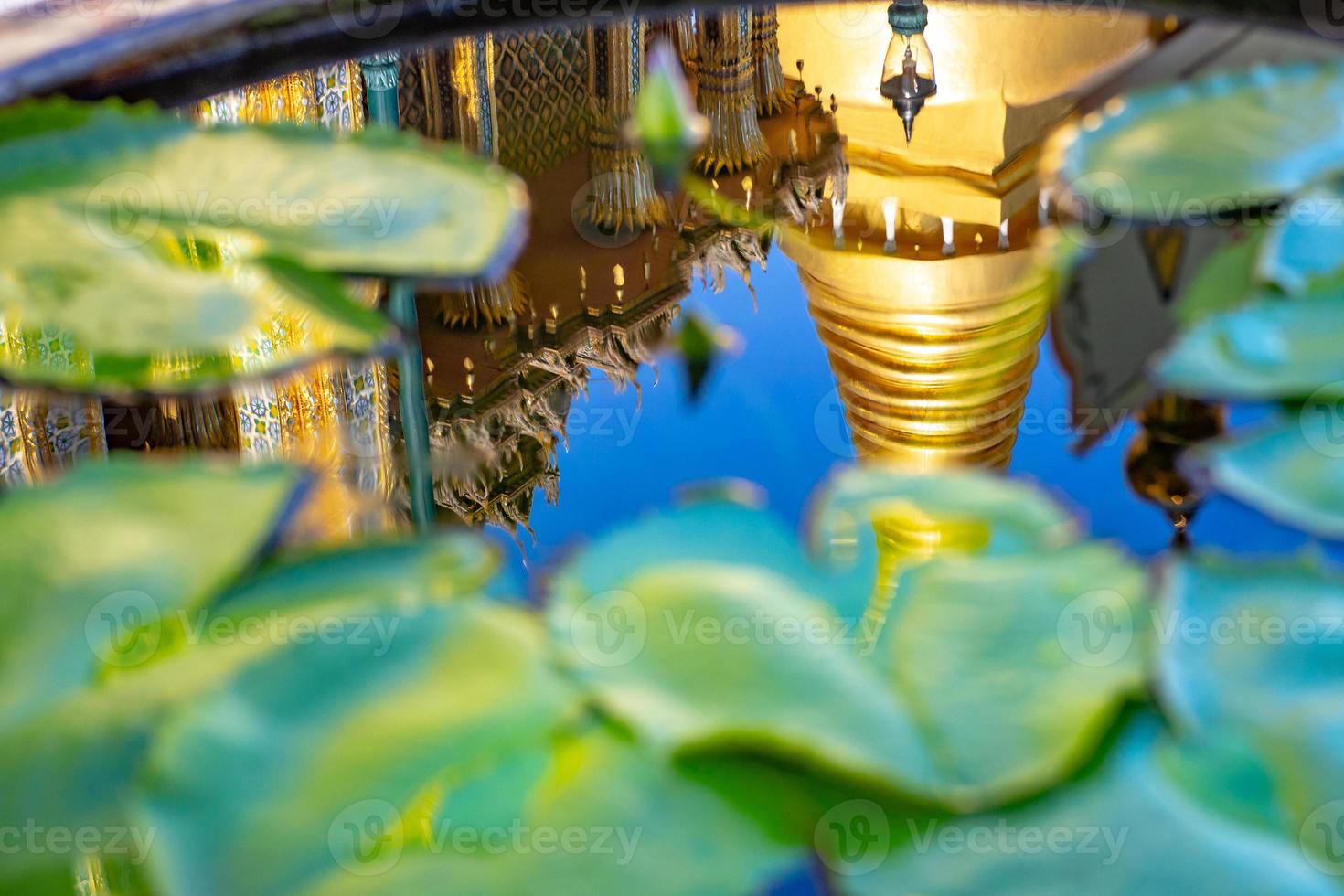Reflection of a beautiful pagoda in a lotus pond photo