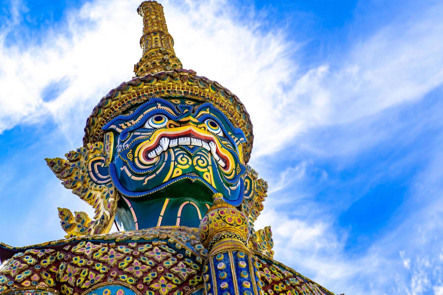 Bangkok, Thailand - 20 June 2022 - An ancient art giant with a unique beauty under a bright sky. Located in Wat Phra Kaew famous tourist attraction Based in Bangkok, Thailand photo