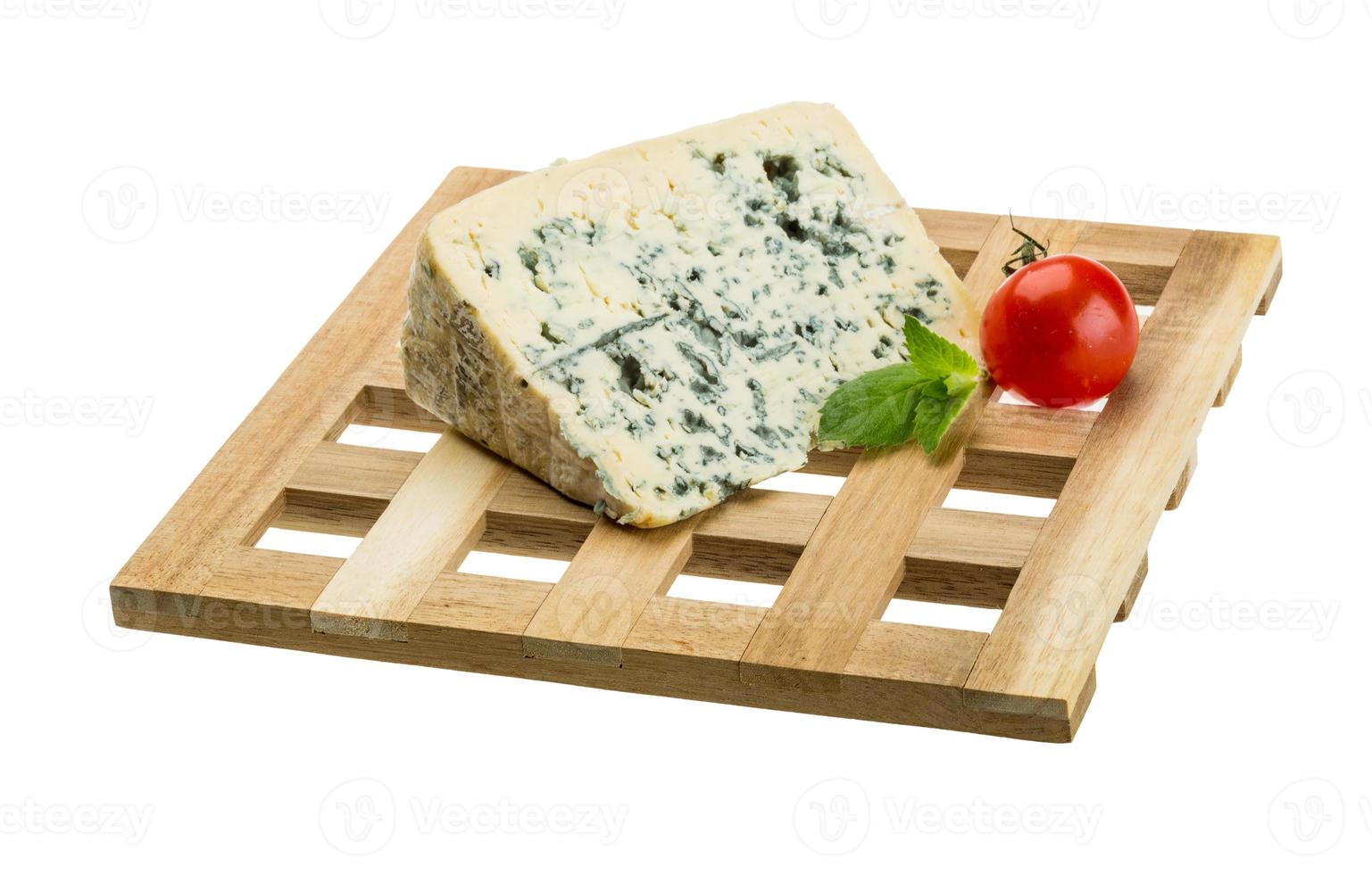 Blue cheese on board  isolated on white background photo