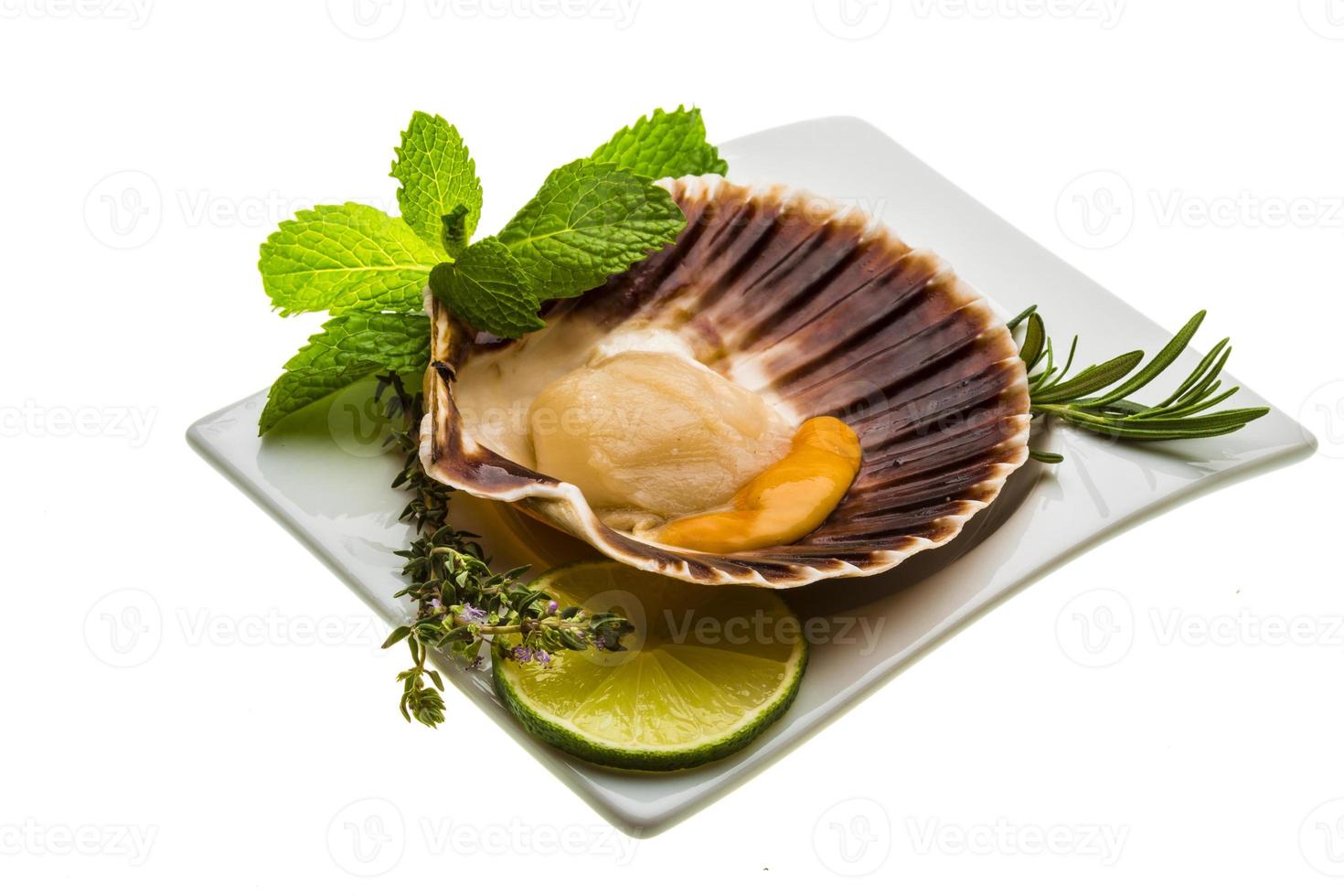 Scallop with asparagus, lime, mint and rosemary photo