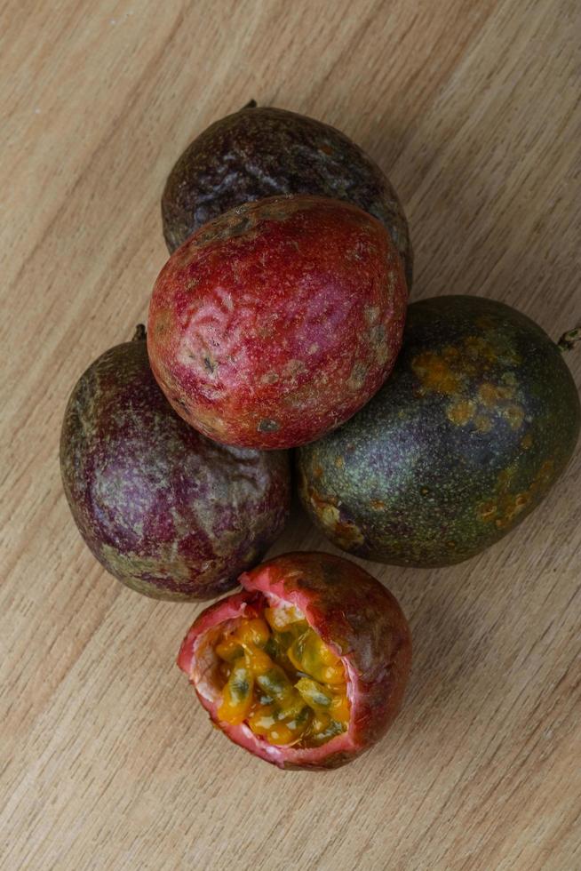 Passion Fruit on wooden background photo