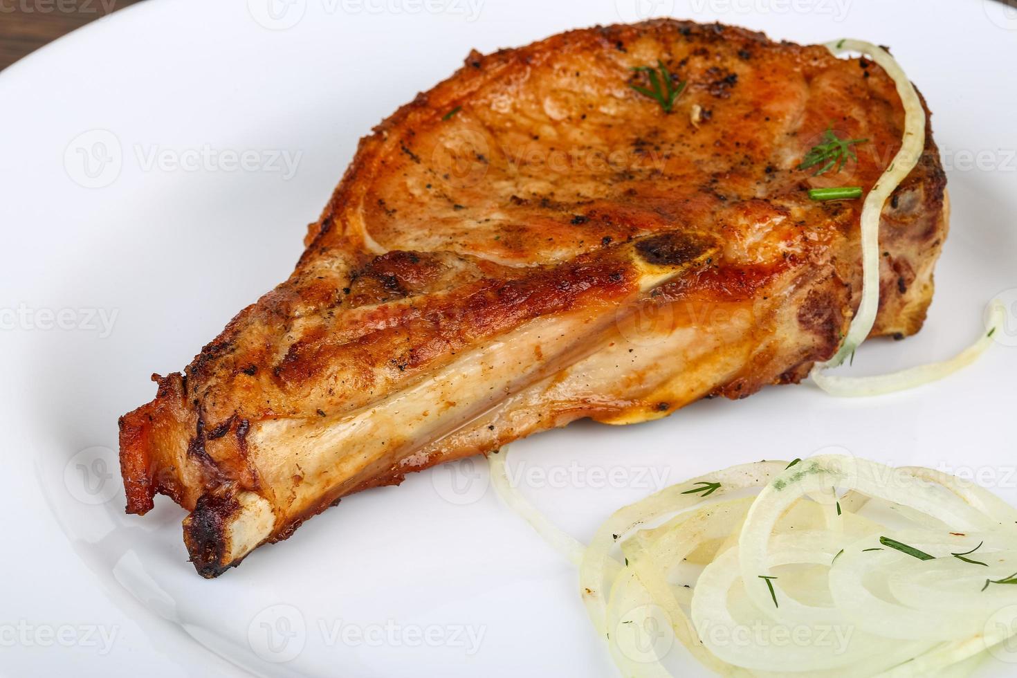 Grilled pork on the plate photo