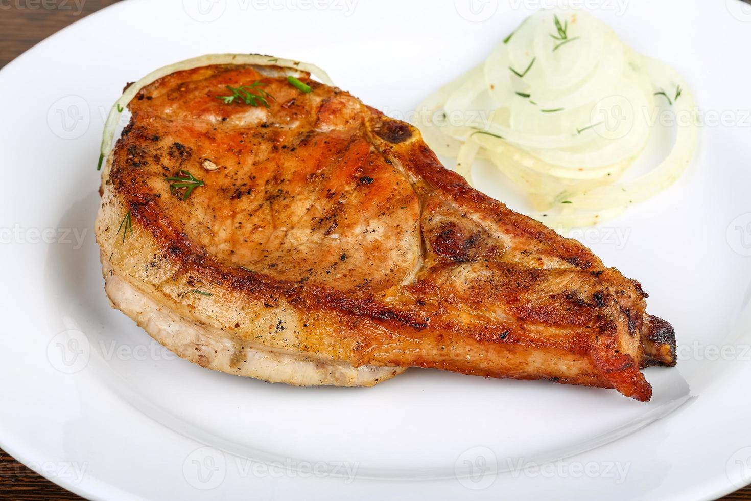 Grilled pork on the plate photo