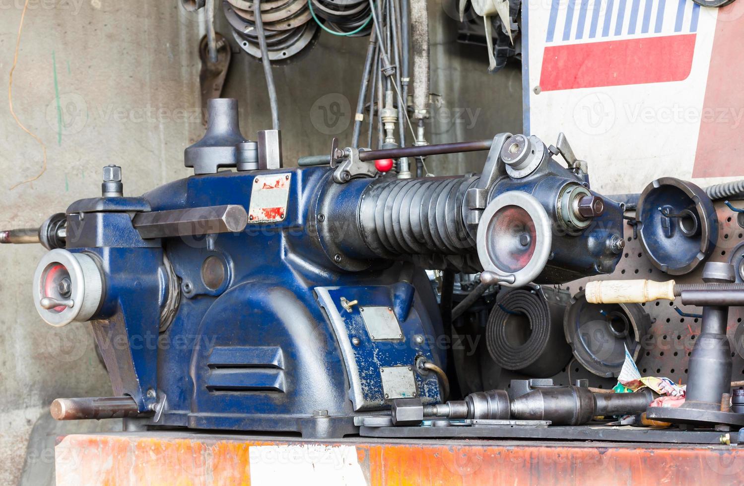 Old lathe in workshop photo