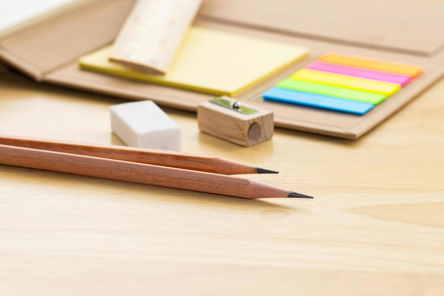 pencil on notebook concept education school equipment on wood table photo