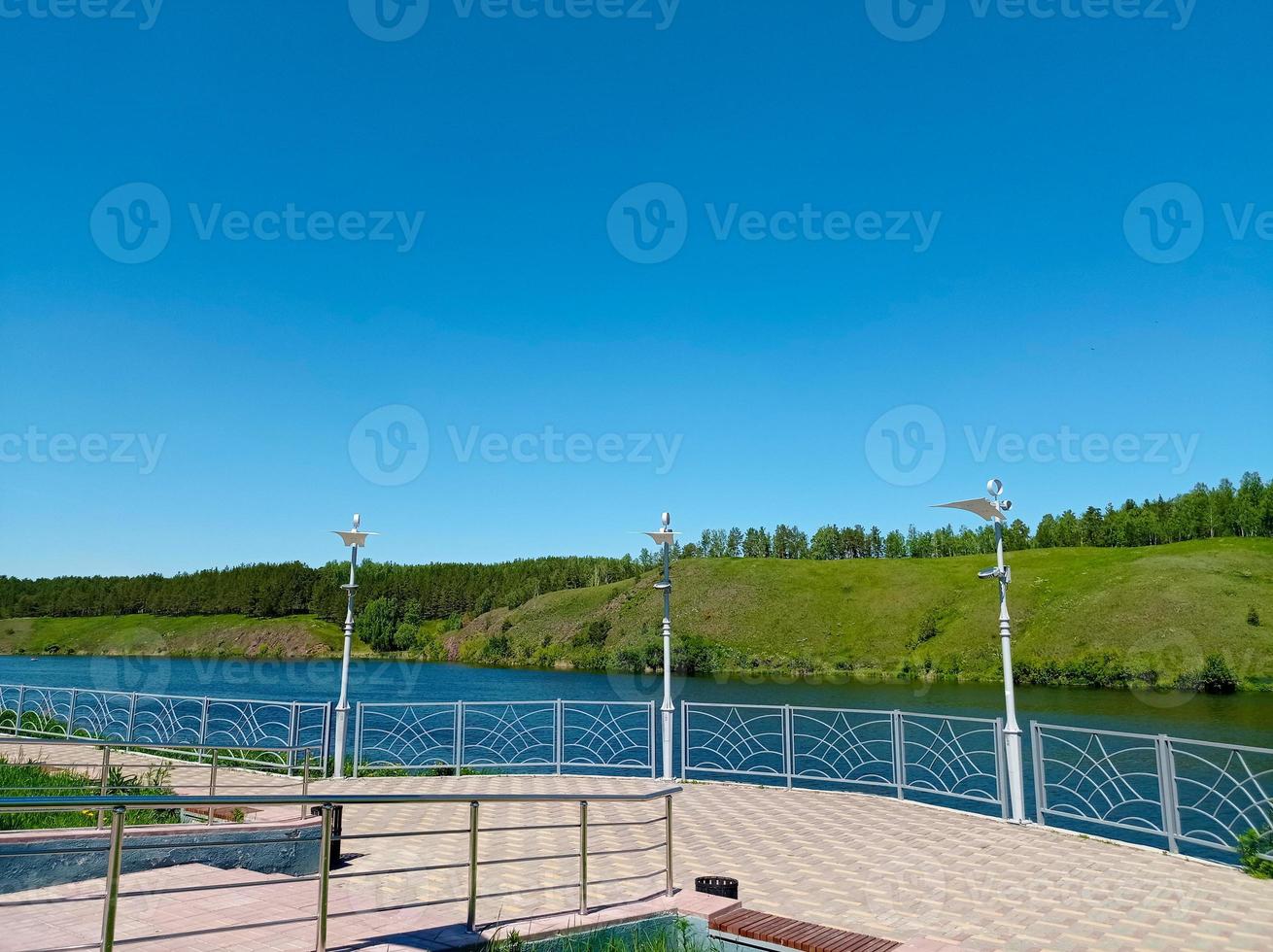 River embankment with a view of the forest photo