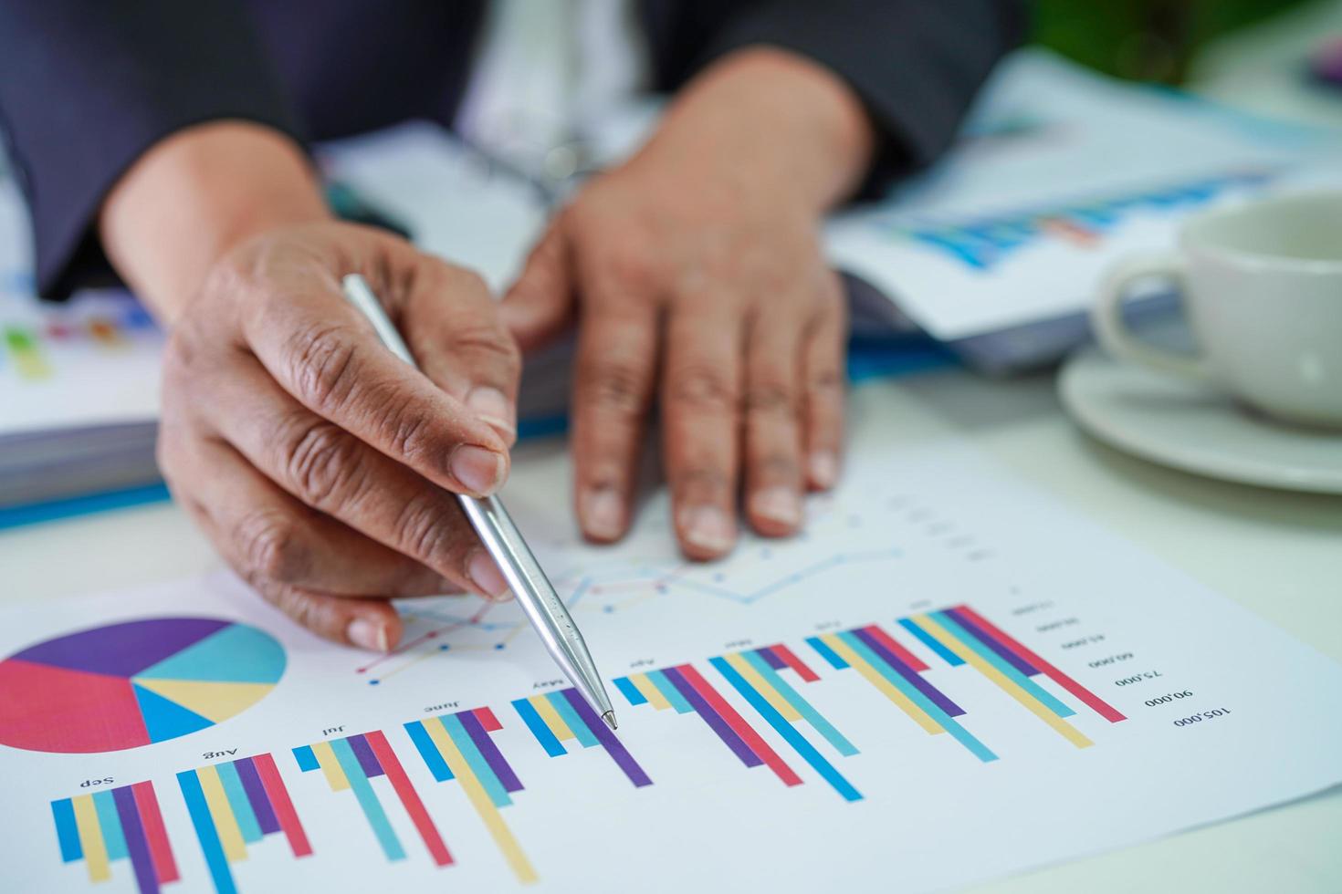 Businessman working and analysis with statistic graph in office. photo