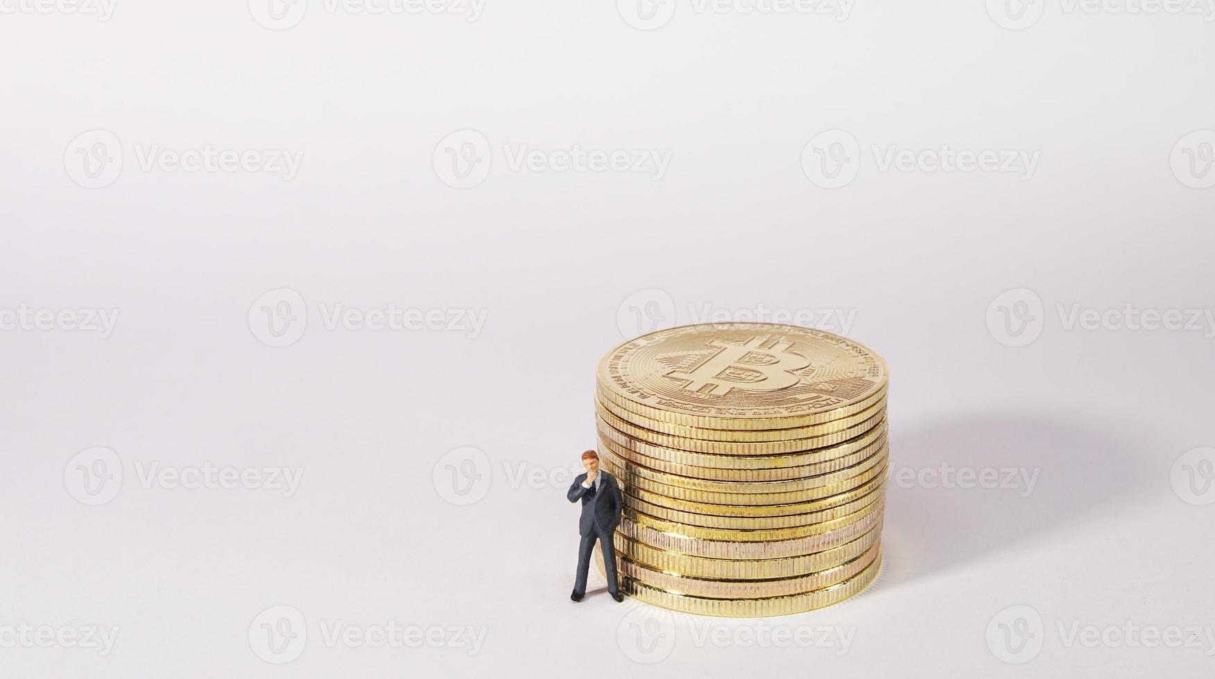 Business man figure standing in front of  bitcoin. Bitcoin mining concept. photo