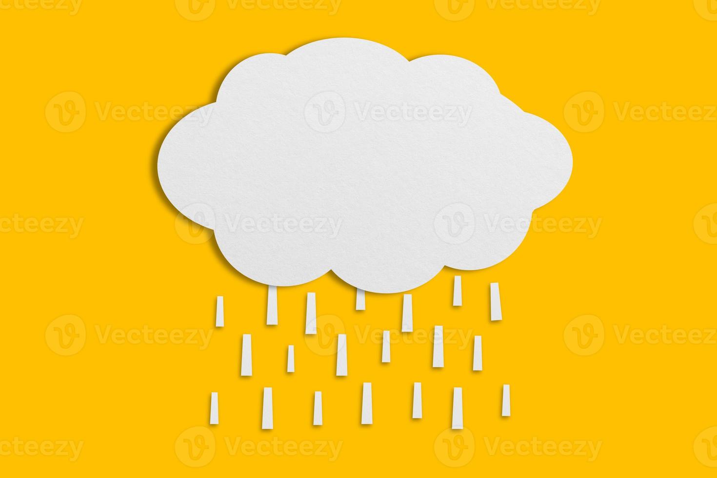 cloud and rain paper white paper cut and paste paper Speech balloon on yellow background. photo