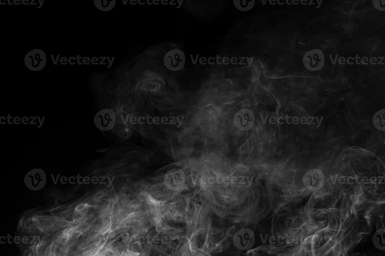 Abstract white smoke animated on a black background photo
