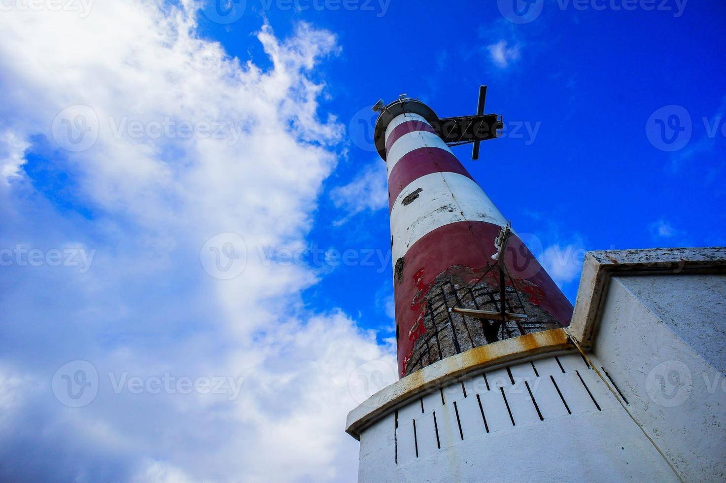 Red and White Lighthouse photo