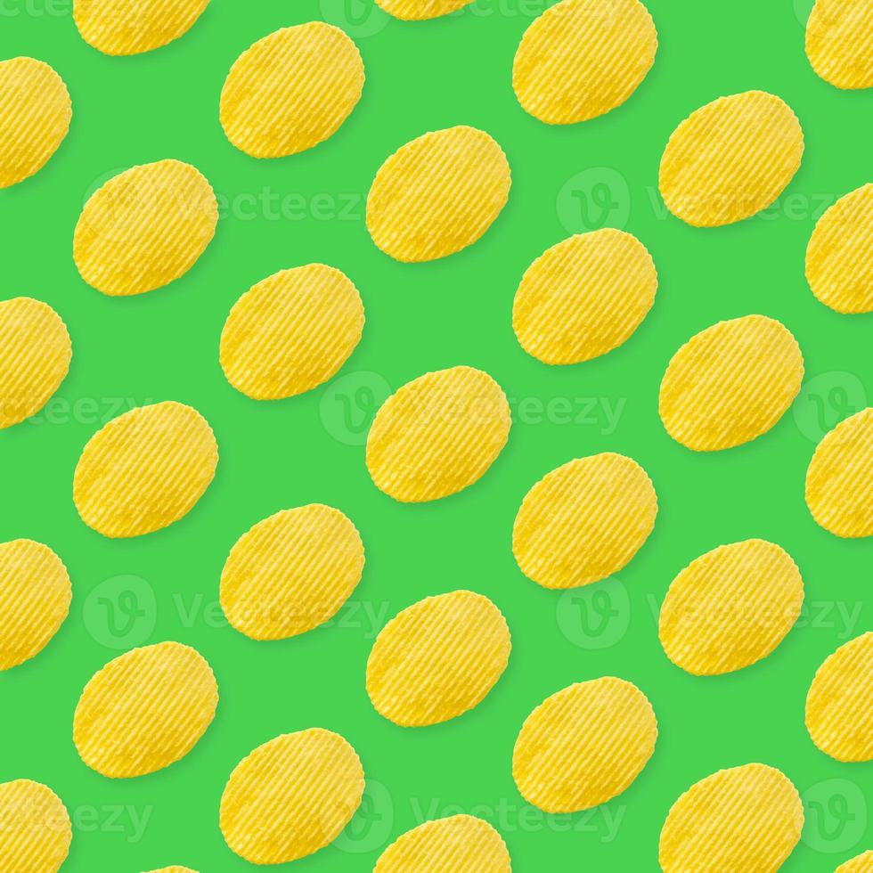 Potato chips pattern on pastel green background top view flat lay photo