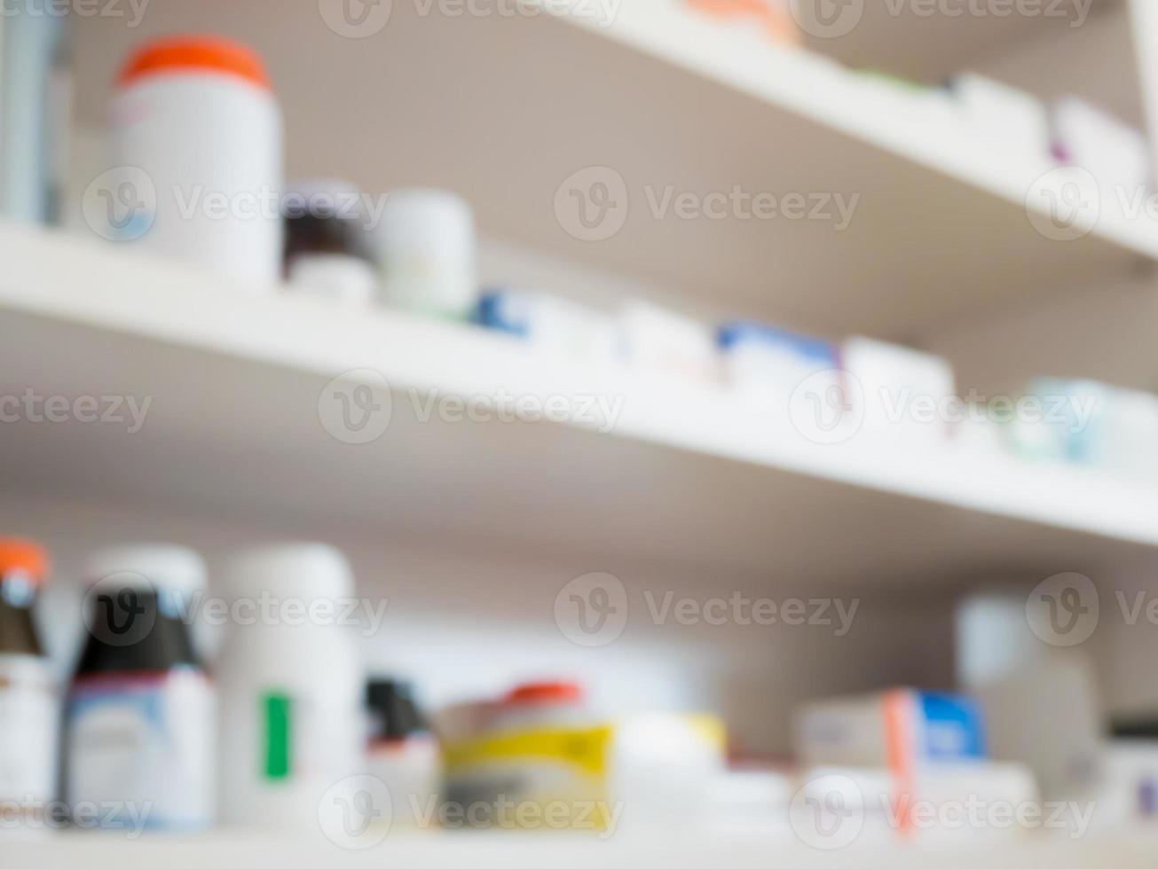 Close up of medicine bottles on shelves of drugs in the pharmacy photo