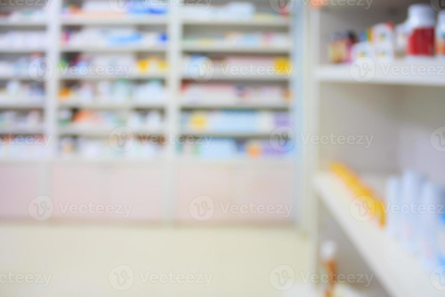 blur shelves of drugs in the pharmacy shop photo