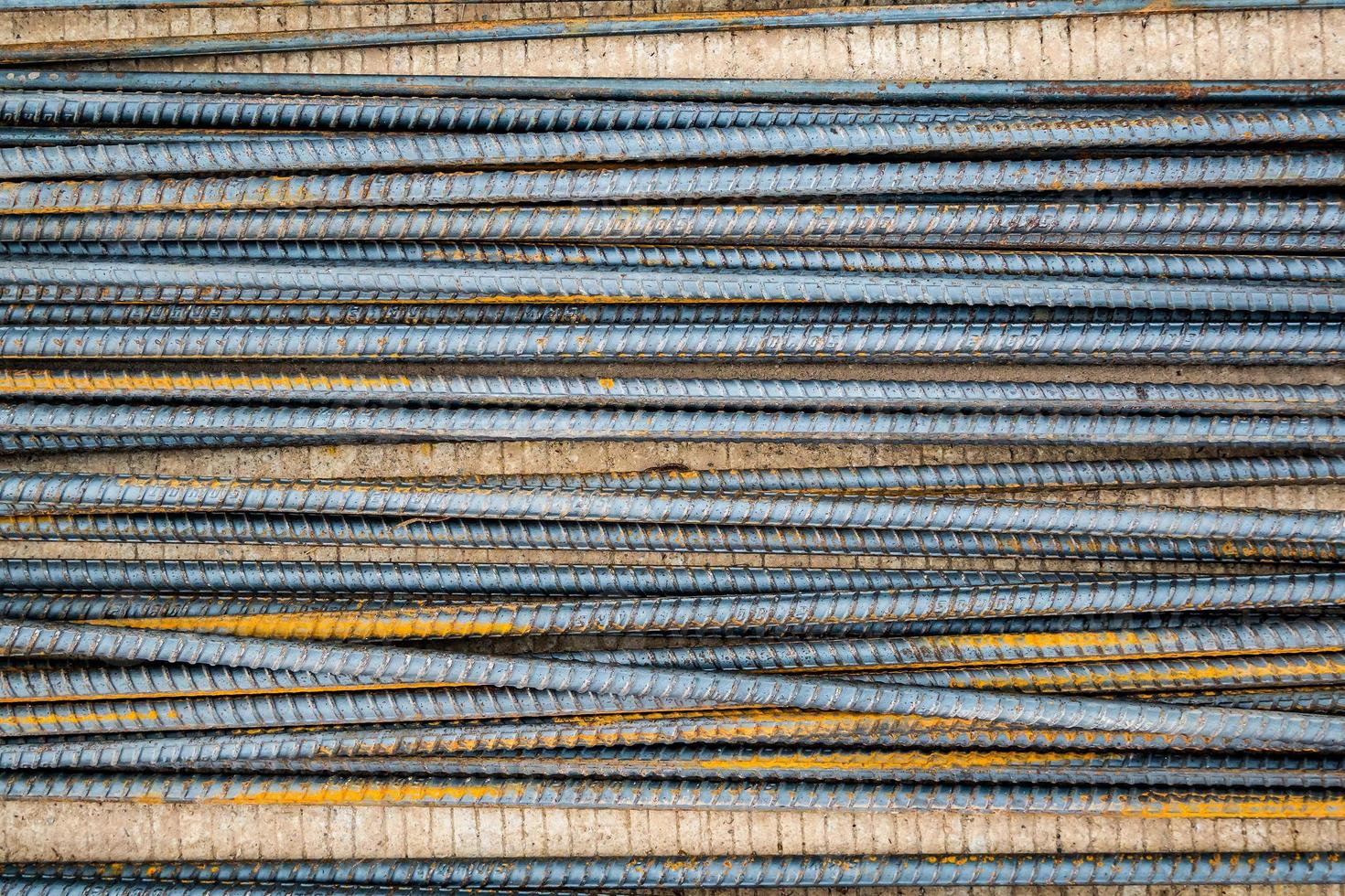 Deformed steel bars metal texture close up photo