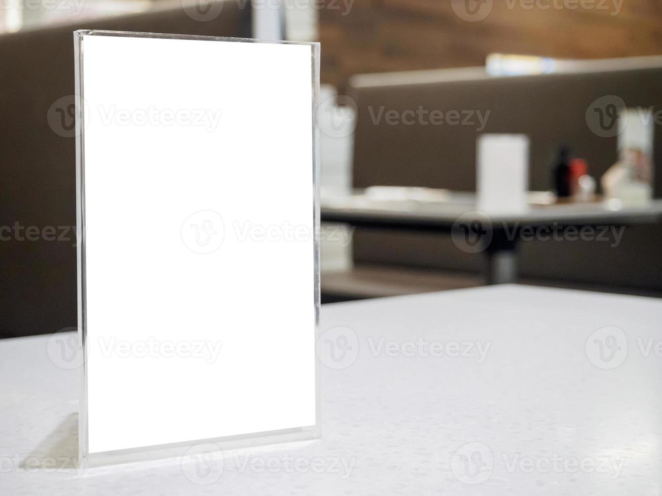 Mock up menu frame on table in the cafe restaurant photo