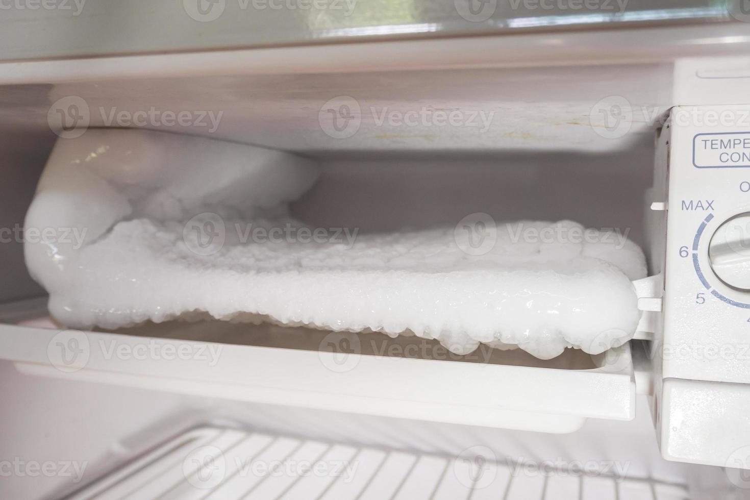 frozen Ice buildup in the freezer of refrigerator photo