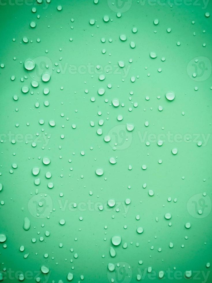 Water drops on green background photo