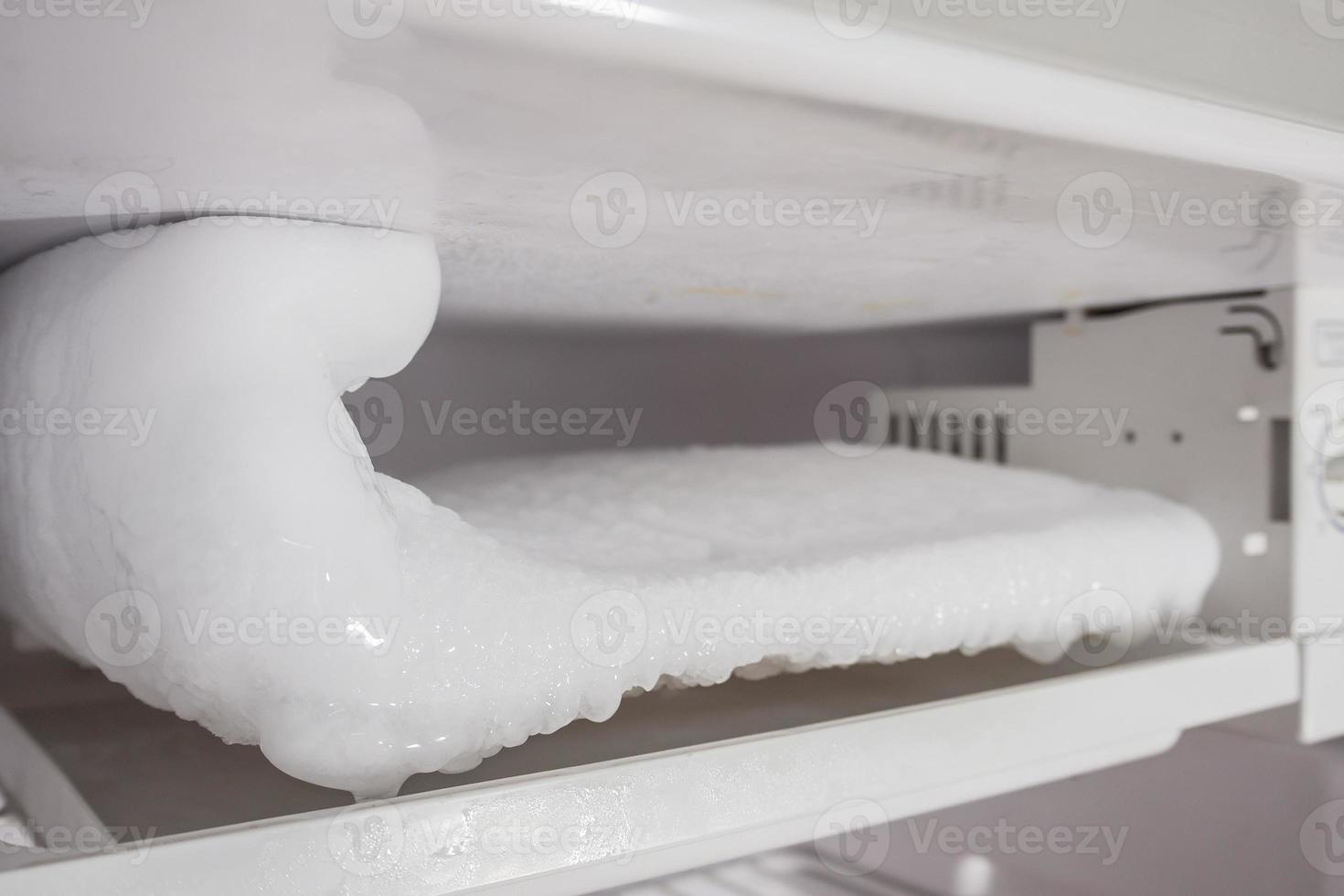 frozen Ice buildup in the freezer of refrigerator photo