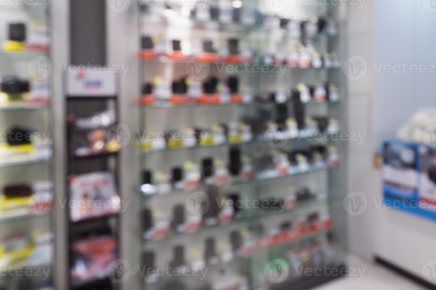 digital cameras and lenses in store shelf blur background photo