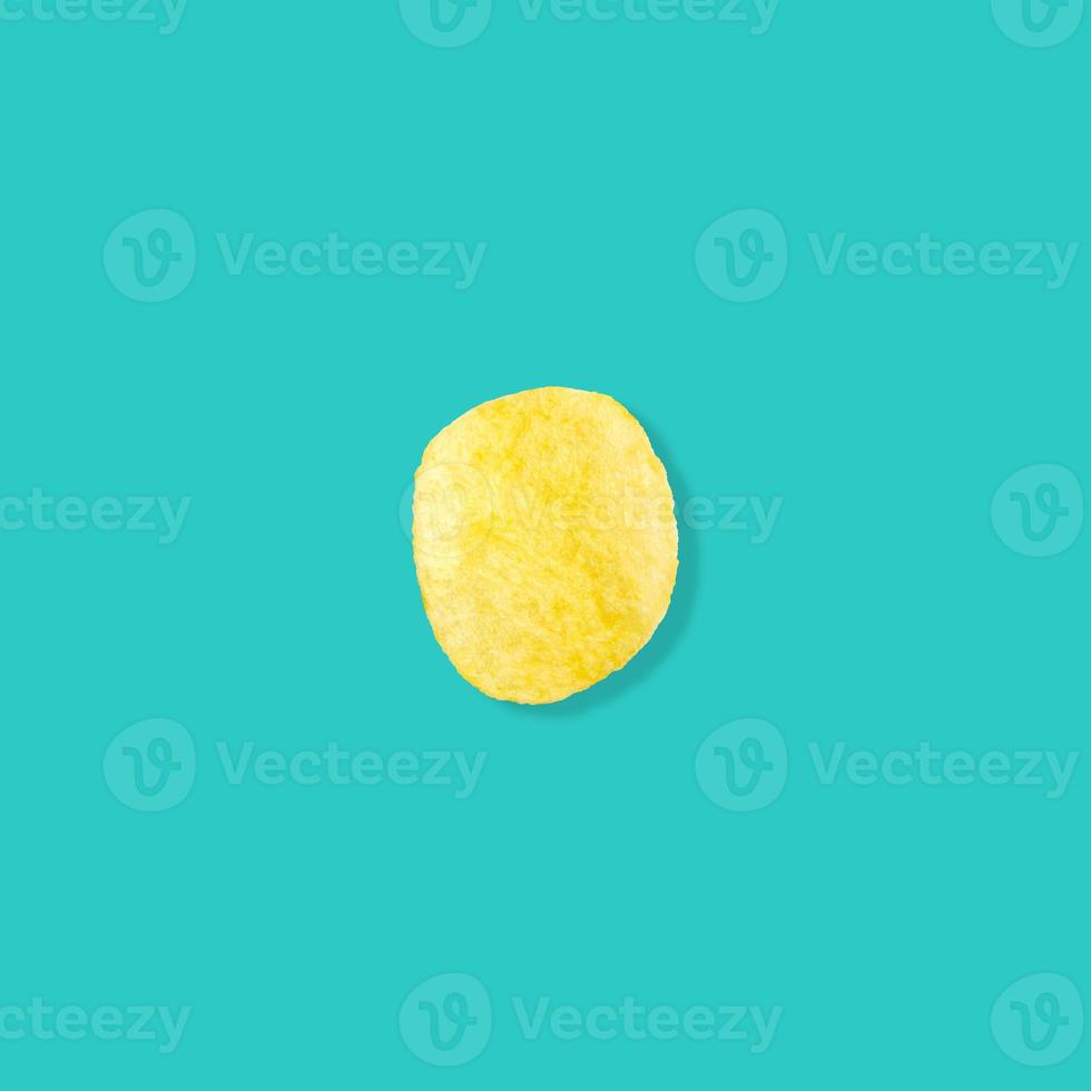 potato chips on pastel blue background top view flat lay photo