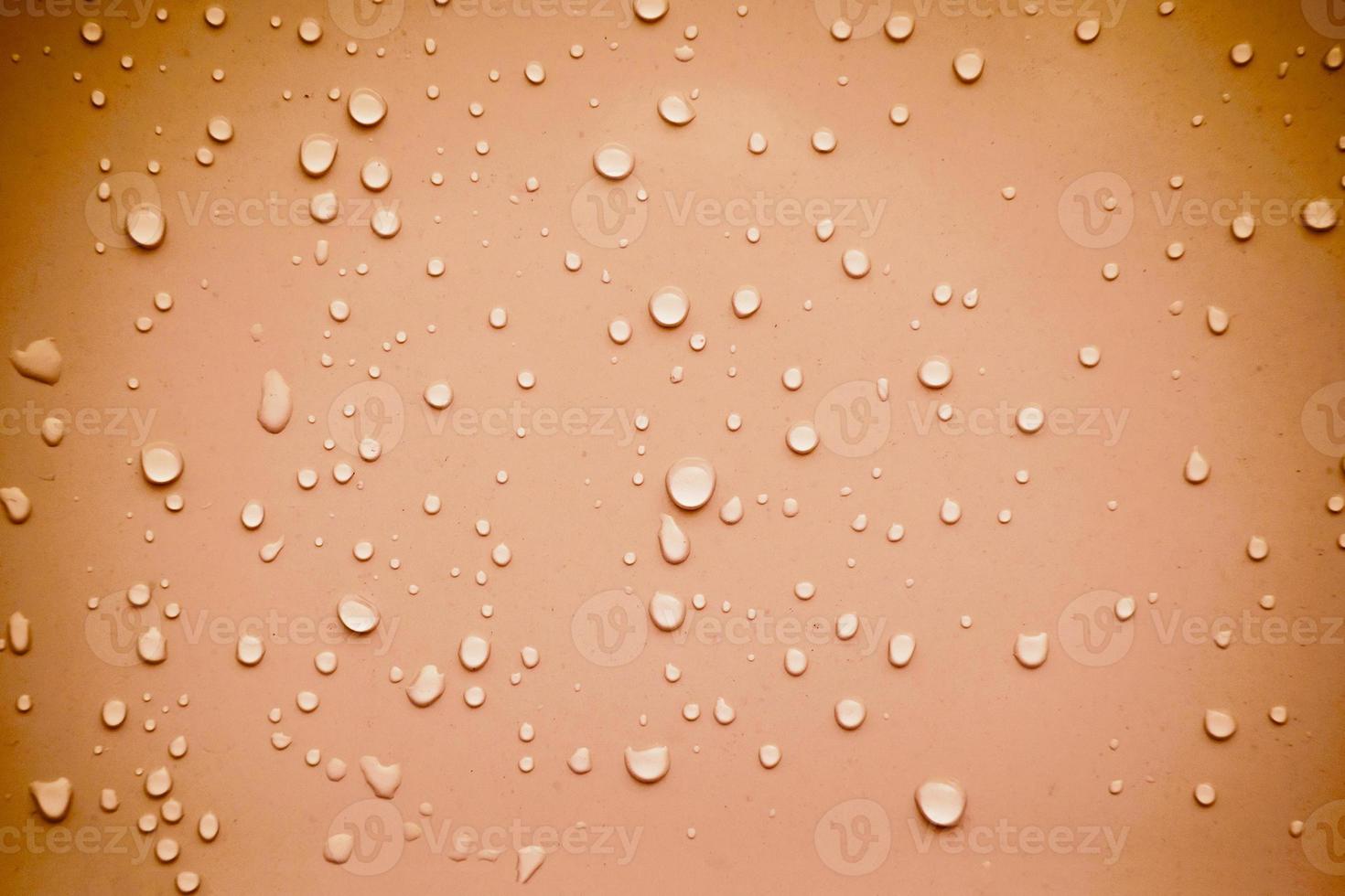 Water drops on brown background photo