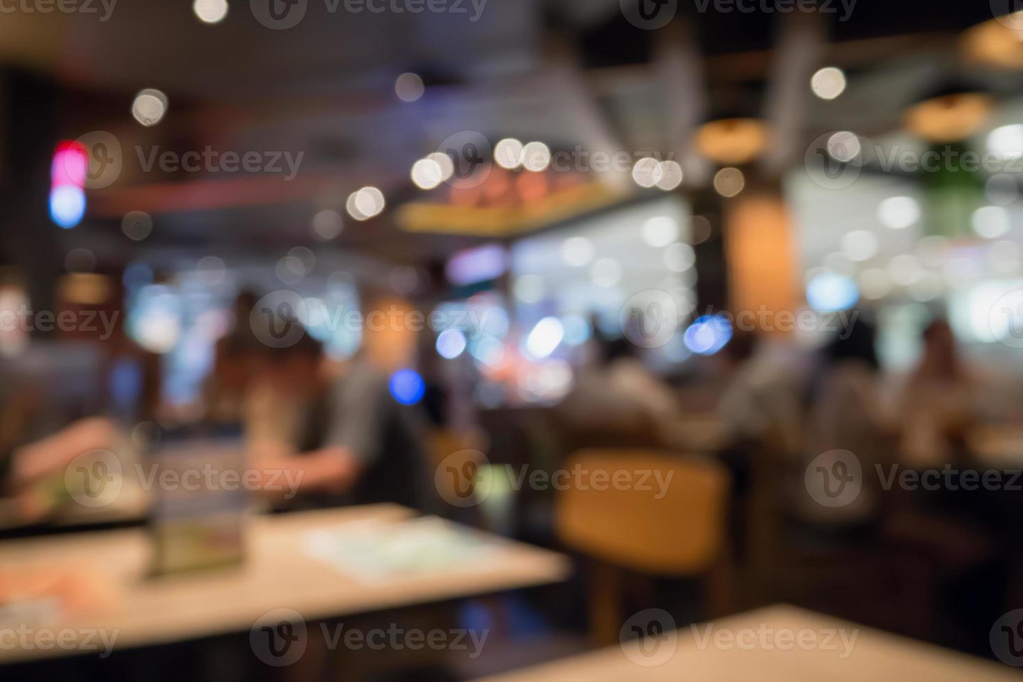 People in restaurant cafe interior with bokeh light blurred customer abstract background photo