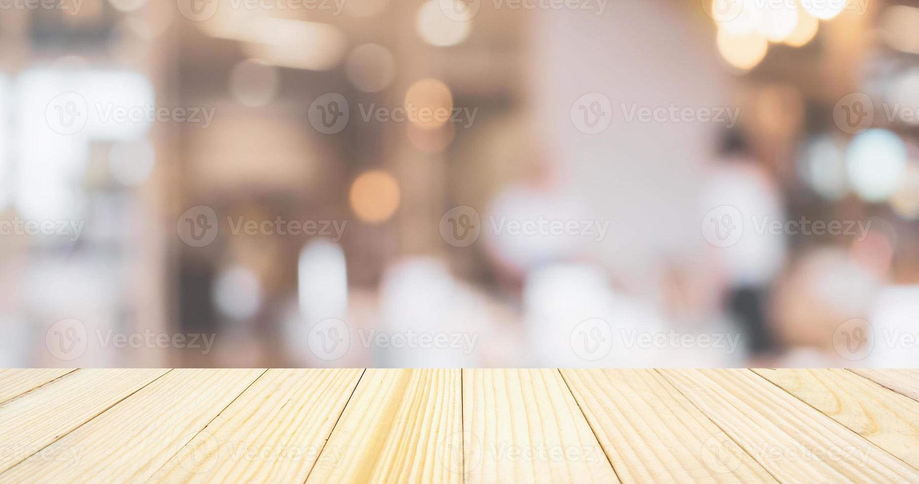 cafe restaurant or coffee shop with abstract bokeh lights defocused blur background with table for product display photo