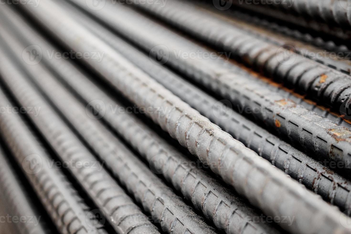 Deformed steel bars metal texture close up photo