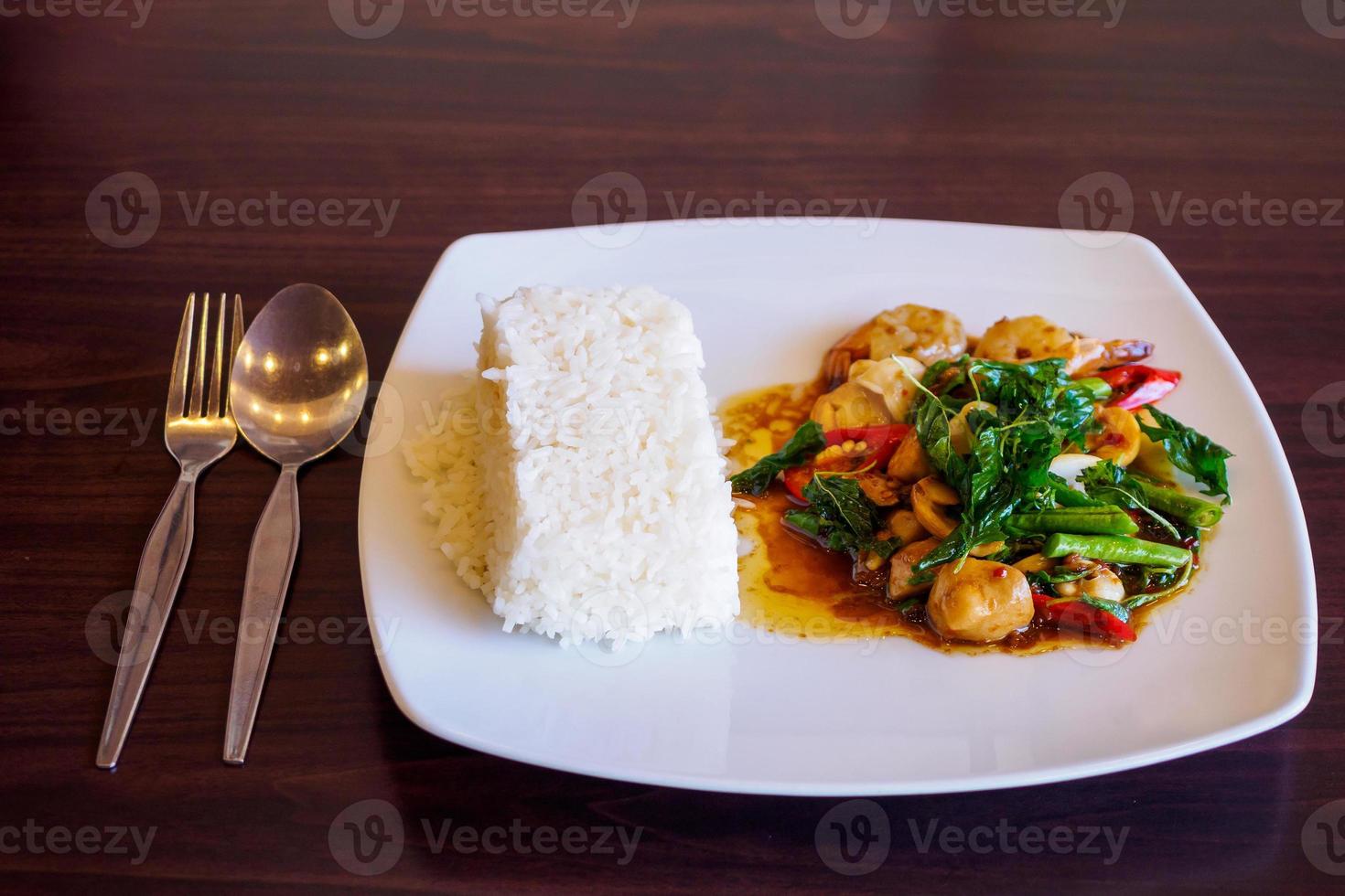 Rice with stir-fried seafood and basil photo