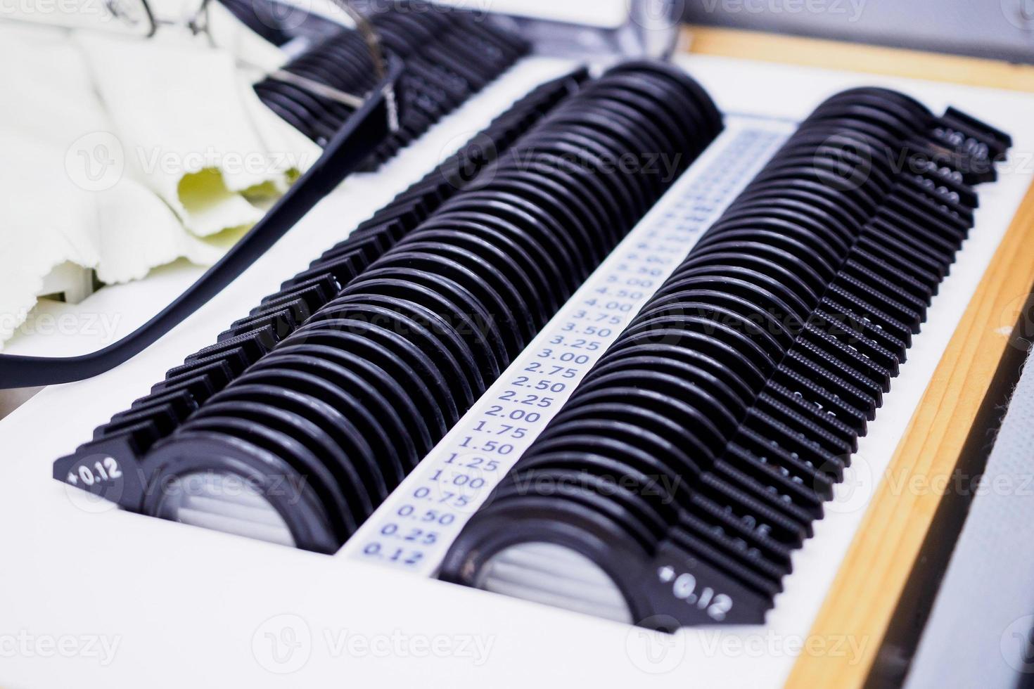set of trial lenses for phoropter for eye examination photo